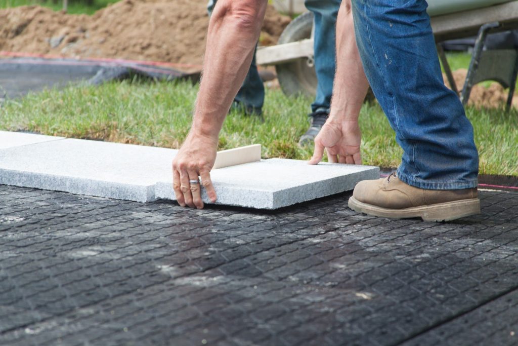 This image has an empty alt attribute; its file name is granite-patio-sets-the-stage-for-lifes-moments-video-sep-09-2020-01-15-12-16-pm-1024x683.jpeg